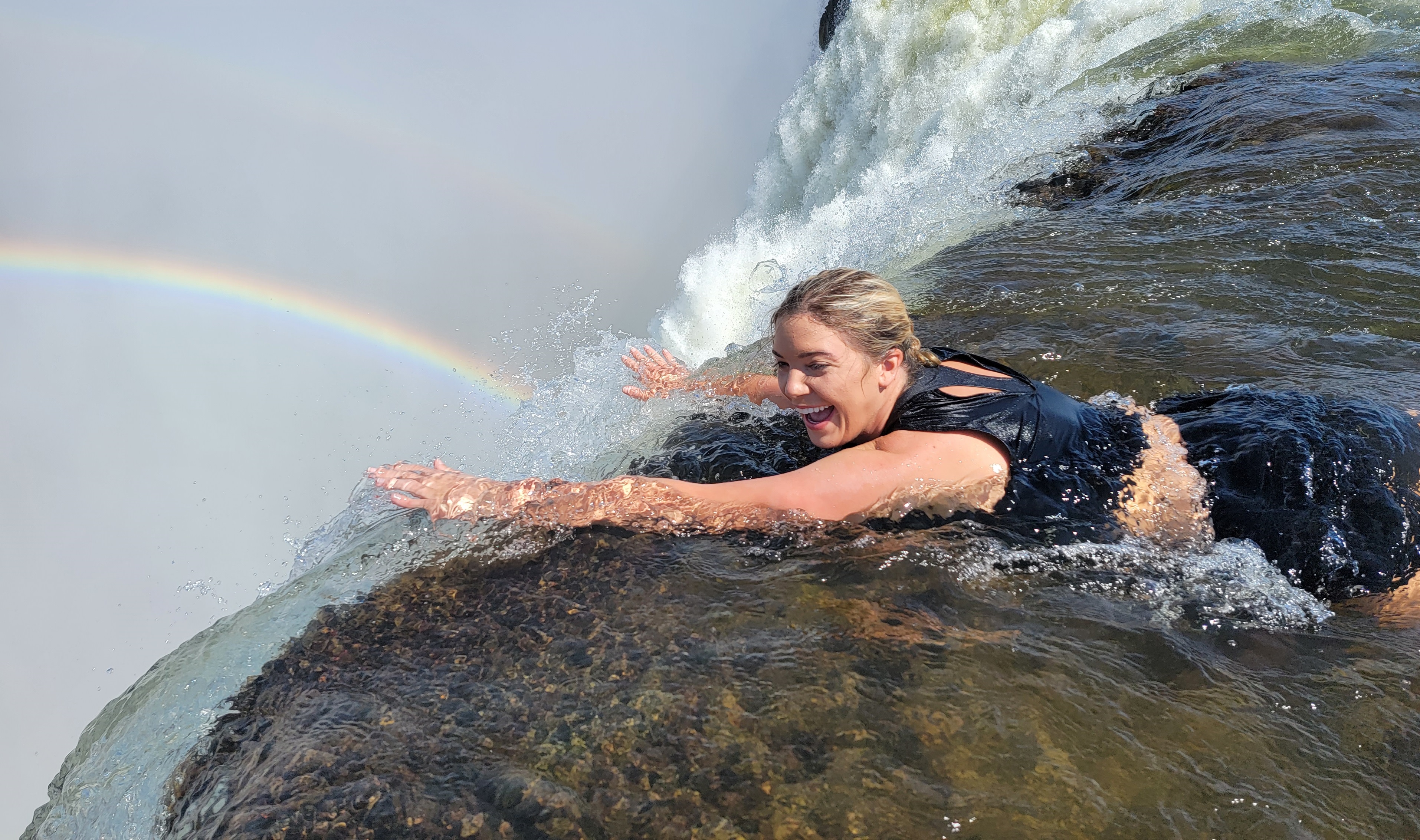 Guests enjoying the seasonal Devil’s Pool experience at Victoria Falls