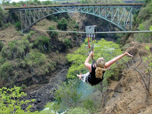 Bridge Slide rider with Victoria Falls Bridge in the background