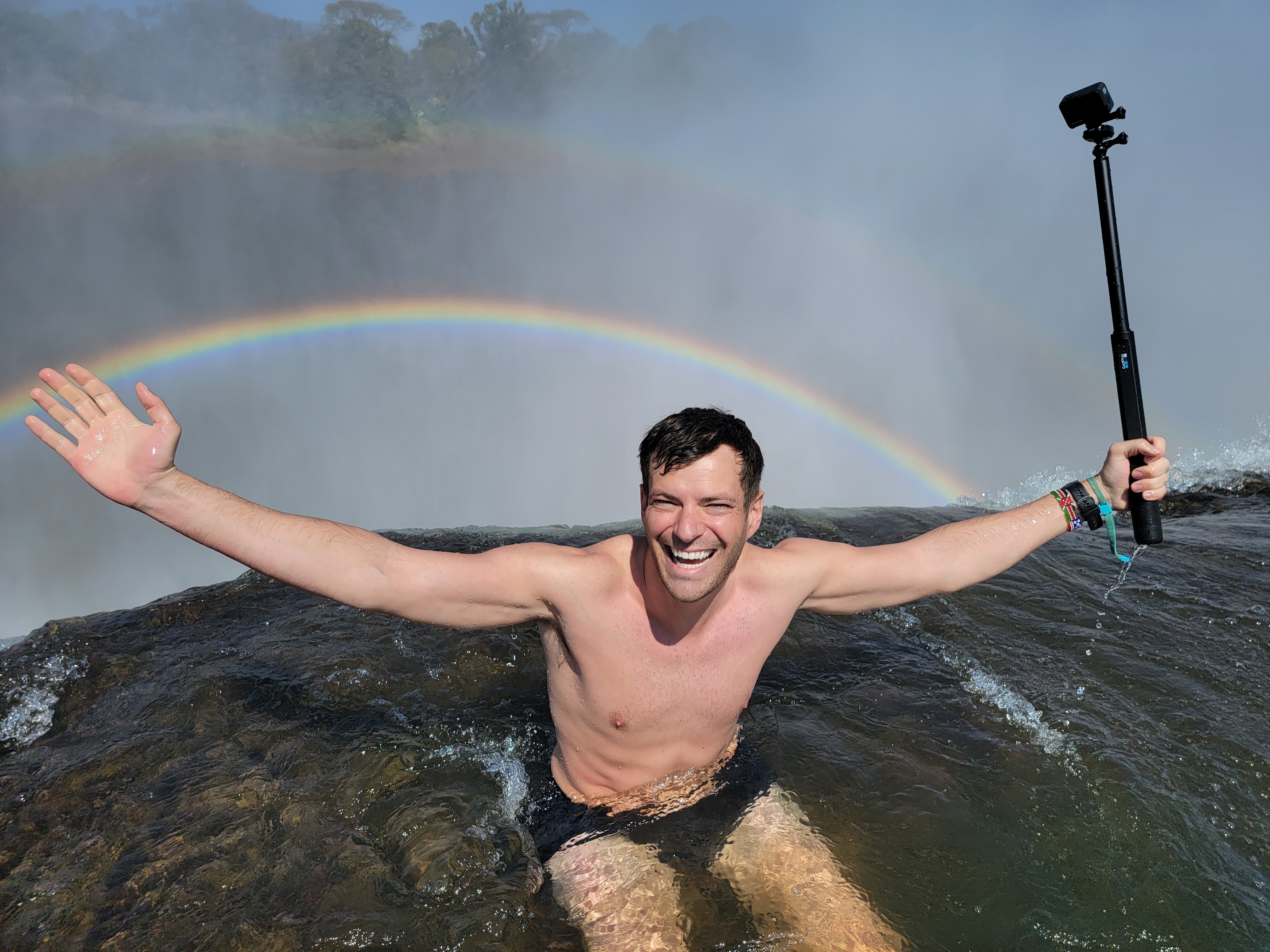 Guests visiting Devil's Pool on Livingstone Island