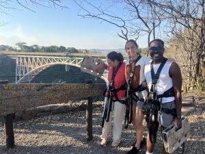 Guests beside the historic Victoria Falls Bridge